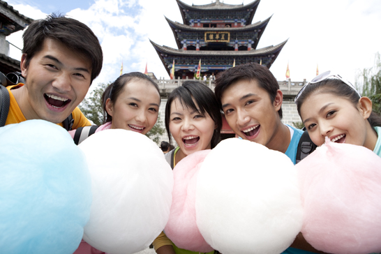 Young Chinese friends with cotton candies in Dali