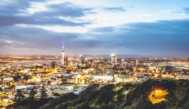 Aerial view of Auckland skyline from Mount Eden after sunset during blue hour - New Zealand modern city with majestic nightscape panorama -  Enhanced filter on night lights