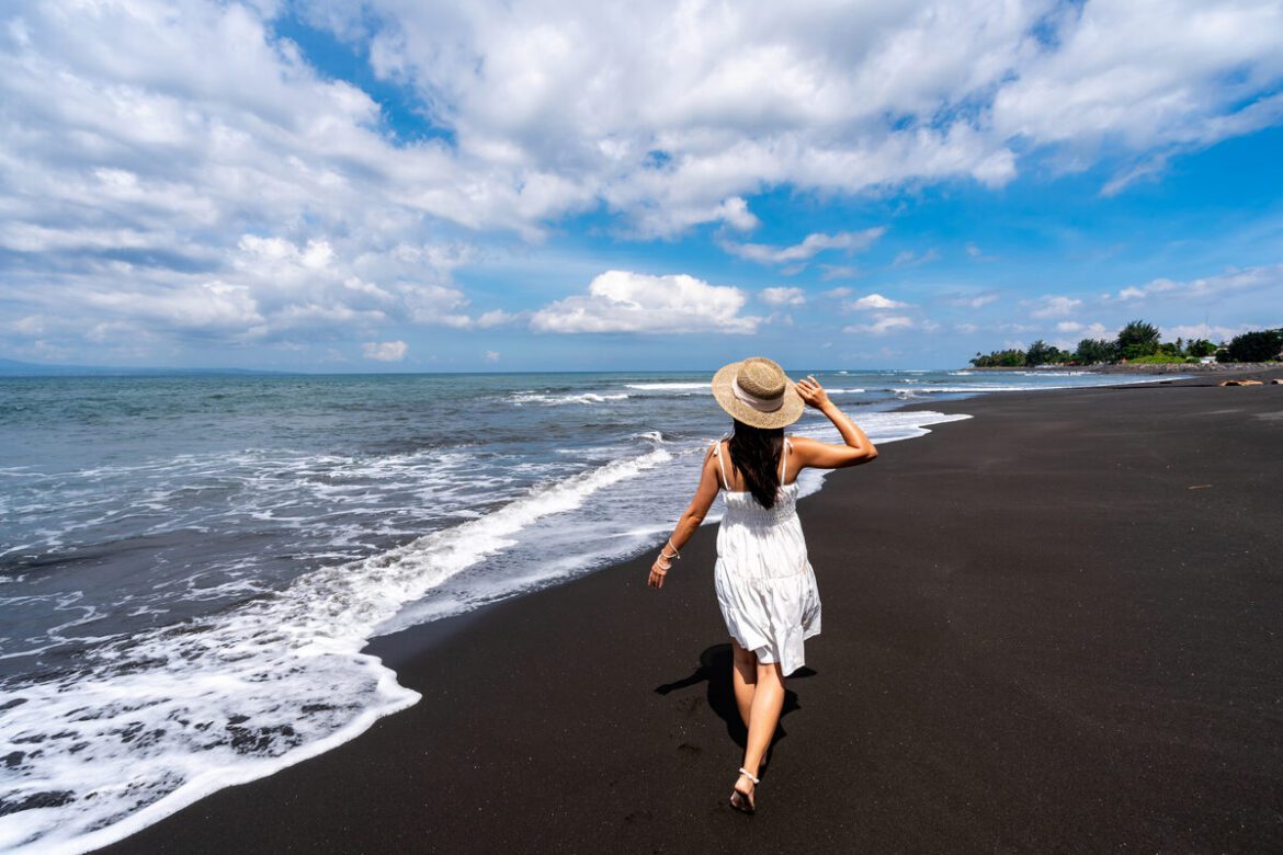 Black sand beach in Amed with traditional jukung fishing boats