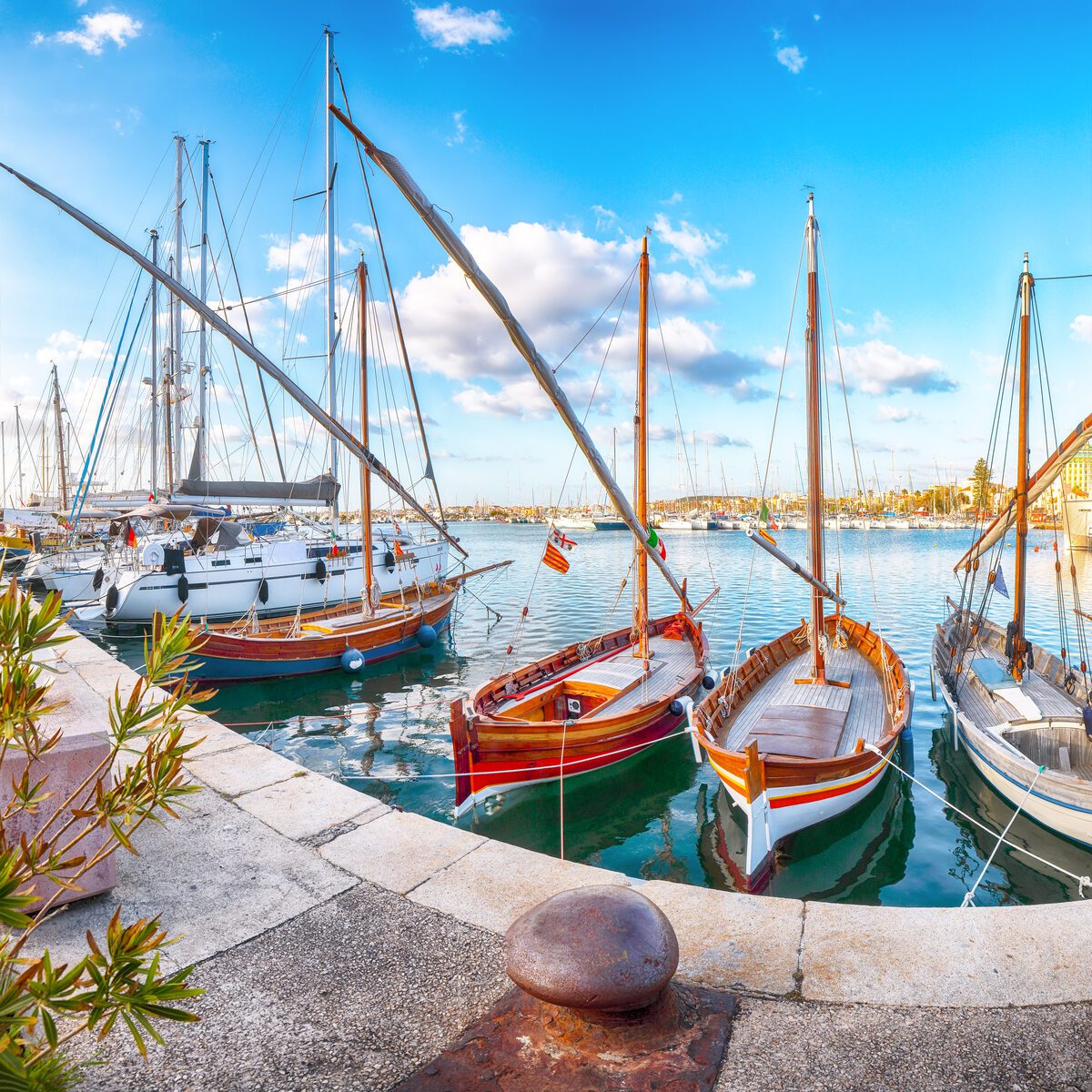 Sunny Mediterranean harbor with fishing boats in early autumn